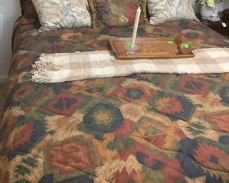 Sleigh bed with comforter, throw and pretty tray.