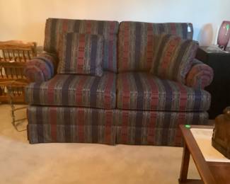 Love seat in living room. Great colors. In excellent condition.