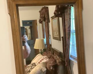 One of the two mirrors on the walnut bedroom suit. The mirrors measure: 48” tall x 21” wide. Same measurement on other mirror.