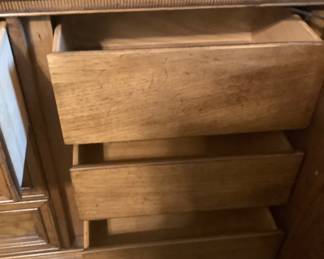 Center drawers n the dresser with 2 doors covering them.