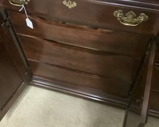 The doors with the 3 pull out drawers in dresser.