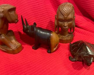 Collection of handcarved wooden figurines, some from Kenya