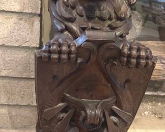 Carved wooden ornamental lion, likely from the 19th century