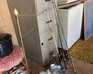 file cabinet, fishing poles, chest freezer, canning pot