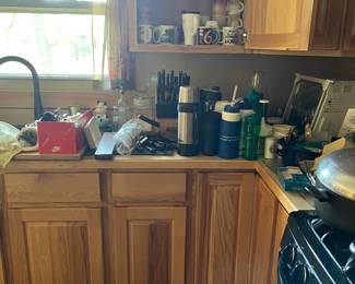 more dishes, glasses, mugs, toaster oven