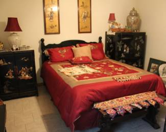 The Oriental bedroom. Queen bed with comforter and red satin sheets