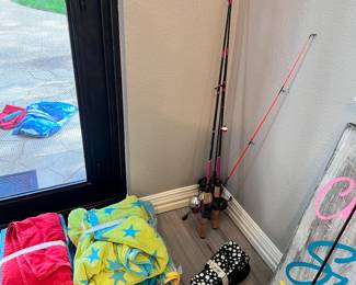Fishing poles, beach towels