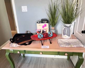 Desk, computer bags, faux plants