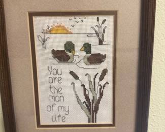 Lots of Owner's Handmade Framed made needlepoint art adorns the her walls.