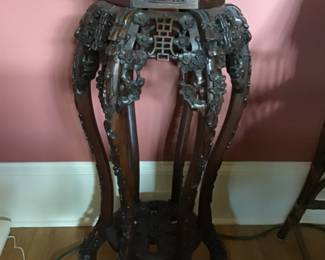 Carved plant stand