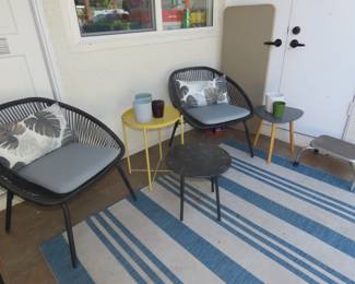 Patio chairs, small tables, vases flower pots.