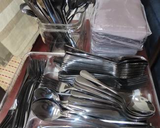 Black metal flatware set.