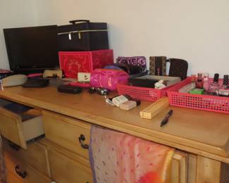 Makeup sets, sewing kits, sunglasses and cases, makeup bags.