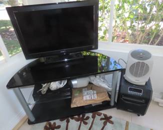 TV and stand. Air purifier.