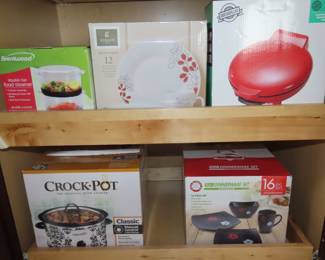 Brand new in boxes, dinner sets, crockpot, steamer, quesa dilla maker.