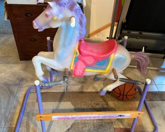 A vintage Silver Wind flexible flyer bouncing horse.