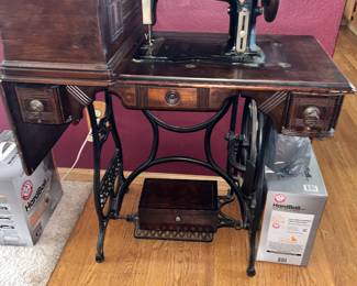 The Eldridge 'B' sewing machine ad cabinet. Note the coffin cover upper left.