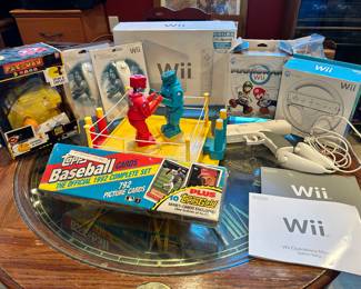 Pac-Man game, Rock 'em Sock 'em boxing game, 1992 factory sealed complete set of Topps Baseball Cards, WII Sports with LOTS of accessories.