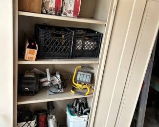 This shows the multi shelf unit with the doors open, exposing the wide variety of the electrical and hand tools for sale.