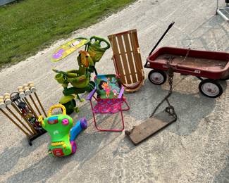 toys & more... croquet set, a cool Fischer Price stroller, a wooden sled, an old playground 'SKOL' swing with chain, a Radio Flyer '18'.