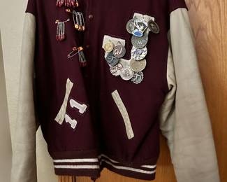 EAGLES! Jefferson, Wisconsin 2011 letter jacket. Full of various wrestling wins/accommodations/achievements and medals.