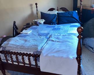 The cherry wood bed with matching Ladies' and Men's dressers (found on the next pic) and an end table.
