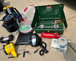 Coleman stove NIB, Gander Mtn Hamberger Press (NIB)BQ grill NIB, brand new cooking set (I pulled the plastic off so you could see the set, H2O carrier bag, all-purpose carrying bag, various power flashlights.
