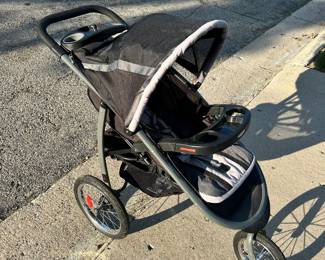 Large three wheel Graco baby stroller.