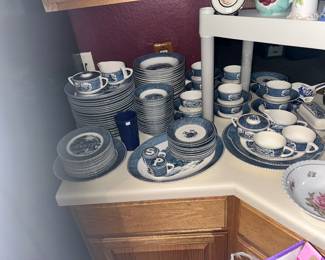 Lots of Currier & Ives dishes with various patterns.