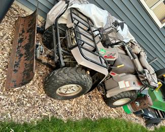 The Big Bear 350 ATV with a snow plow attachment
