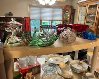 An assortment of various colored glass items.