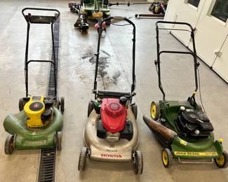 3 lawn mowers on the left - John Deere, middle - Honda, and on the right - another John Deere. All 3 mowers were/have been reconditioned by the Jefferson High School Students.