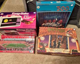 Easy Bake Oven, 1,000 pc. Unv. Of Wisconsin Camp Randall puzzle, California Raisin game, Harry Potter, and the Sorcerer‘s Stone game. Just an example of the many games and puzzles for sale.