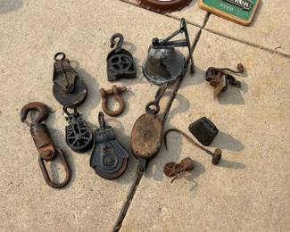 A vintage Kamet Lock Latch, bell w/ a mounting bracket, various pullies, a cow bell, hay hook and more...