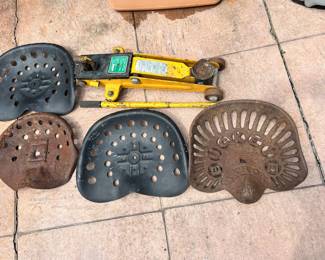 4 tractor seats, one is Buckeye! Not the 2 ton jack that is also showing.