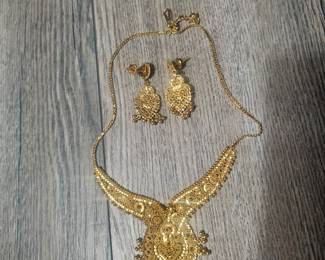 Hand crafted in India. 22kt heart necklace and matching earrings set...weighs around 37 grams