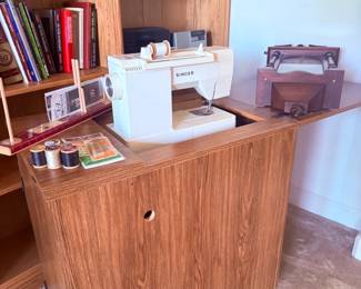 Singer sewing machine in cabinet