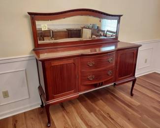 Mahogany Bench Made English Sideboard Morgan & Co. The Hayes Cardif. 65" W, 22" D and 38" H with an additional 22" H Mirror backsplash. Hand Cut Dovetails. Morgan and Co. was a department store in Cardif that opperated between 1879 and 2005.