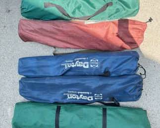 Five Collapsible Chairs And A Small Canopy