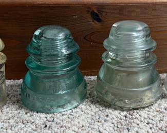 Four Glass Insulators