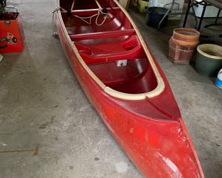 Resin canoe with 2 paddles (so you won't be up a creek without a paddle!) about 17' long.