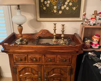 Serving piece with copper top, white hobnail lamp, brass candlesticks 