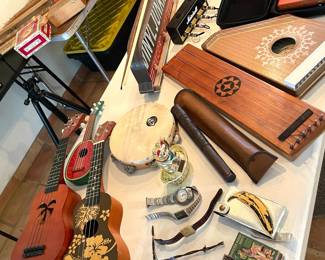 Ukuleles, watches, stringed instruments, kalimba, light up metal signs, refrigerator magnets
