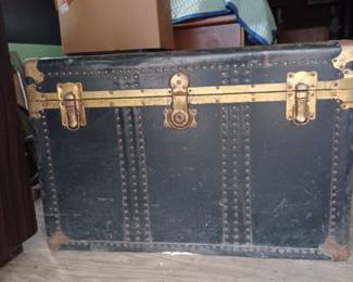 Large leather and metal steamer trunk. A total of 4 trunks are available.