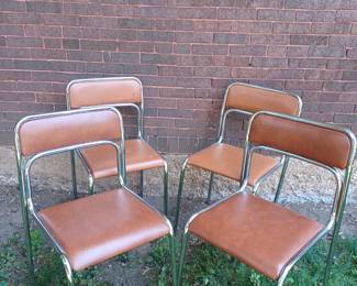 2 pairs of stackable brown vinyl and chrome chairs - slightly different colors but could possibly be used as a set of 4