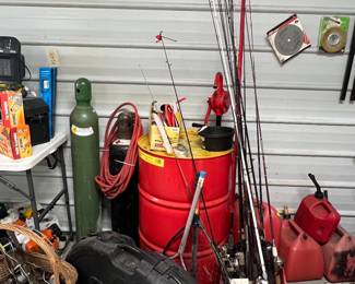 Fishing, barrel of oil (half full), welding tanks, bow & case , gas cans sm & lg