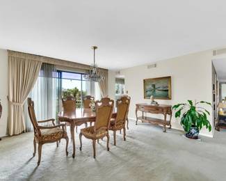 Dining room table, 6 chairs, and sideboard.
