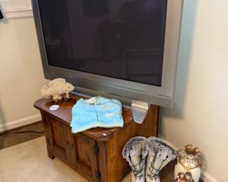 Wooden Cabinet, TV, Glazed Ceramic Fish Sculpture, Boots