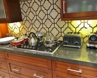 Counter-Top Appliances and Red Enamel Cookware