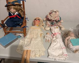 Numerous antique dolls.